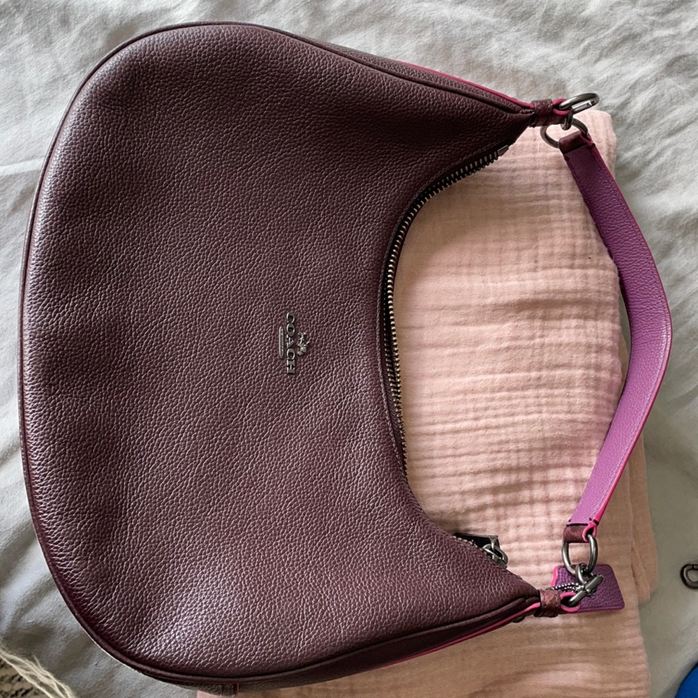 Plum colored Coach bag. Used only twice. Great.